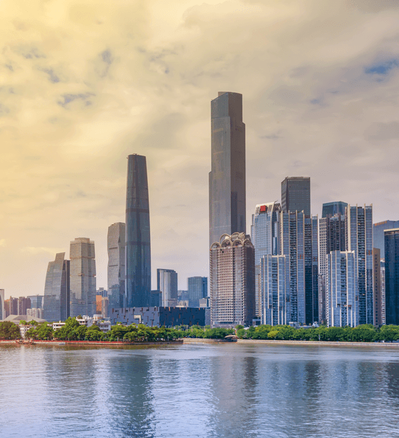 Skyscrapers reflecting on a calm river, symbolizing prosperity
